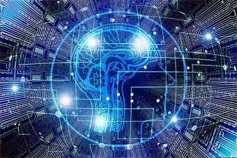 A digital representation of a head and brain in front of a circuitboard